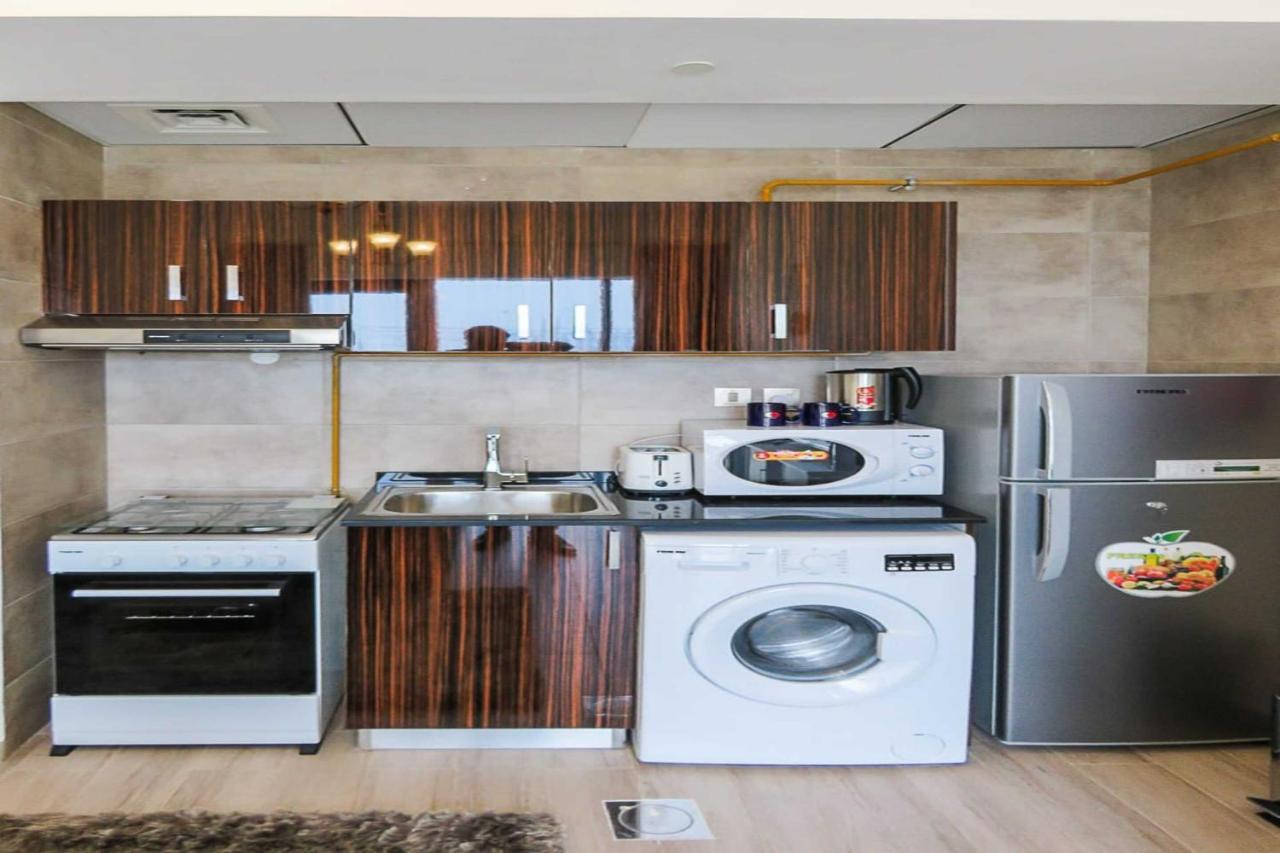 Oyo 860 Studio Apartment, Maya Tower 4, Jumeirah Village Triangle Dubai Esterno foto